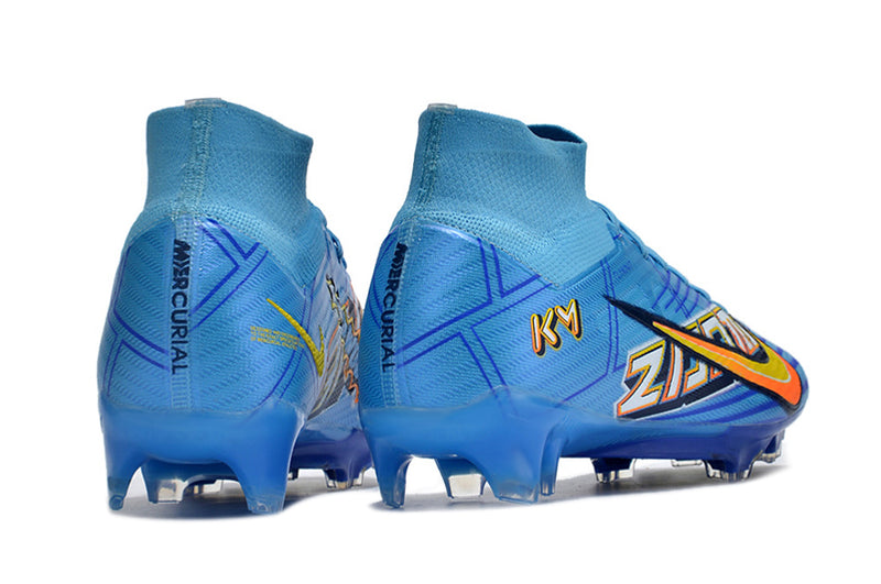 CHUTEIRA NIKE AIR ZOOM MERCURIAL SUPERFLY 9 ELITE CAMPO "MBAPPÉ COMIC" - AZUL E AMARELA