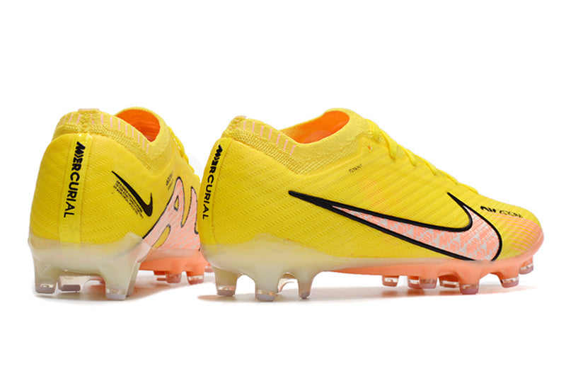 CHUTEIRA NIKE AIR ZOOM MERCURIAL VAPOR 15 ELITE CAMPO (AG) "LUCENT PACK" - AMARELA E LARANJA