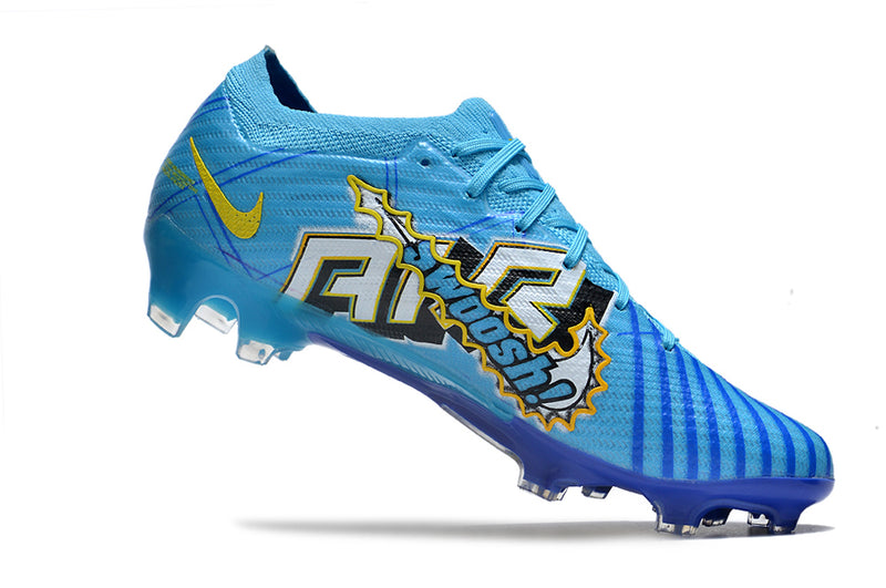 CHUTEIRA NIKE AIR ZOOM MERCURIAL VAPOR 15 ELITE CAMPO "MBAPPÉ COMIC" - AZUL E AMARELA