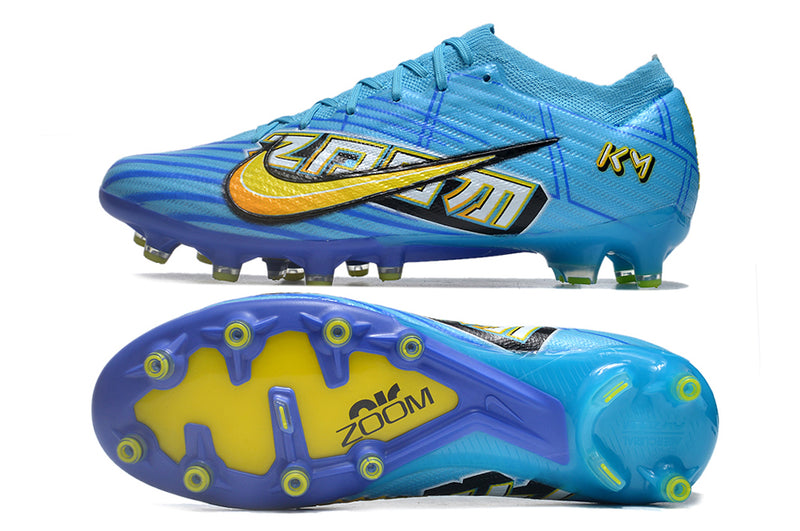 CHUTEIRA NIKE AIR ZOOM MERCURIAL VAPOR 15 ELITE CAMPO (AG) "MBAPPÉ COMIC" - AZUL E AMARELA
