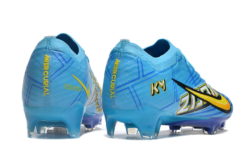 CHUTEIRA NIKE AIR ZOOM MERCURIAL VAPOR 15 ELITE CAMPO "MBAPPÉ COMIC" - AZUL E AMARELA