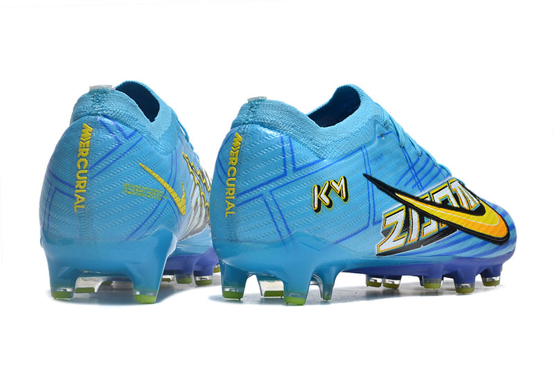 CHUTEIRA NIKE AIR ZOOM MERCURIAL VAPOR 15 ELITE CAMPO (AG) "MBAPPÉ COMIC" - AZUL E AMARELA
