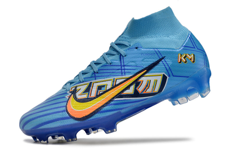 CHUTEIRA NIKE AIR ZOOM MERCURIAL SUPERFLY 9 ELITE CAMPO "MBAPPÉ COMIC" - AZUL E AMARELA