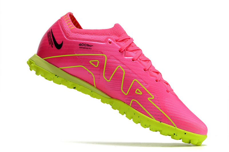 CHUTEIRA NIKE MERCURIAL AIR ZOOM VAPOR 15 ELITE SOCIETY "LUMINOUS" - ROSA E AMARELA