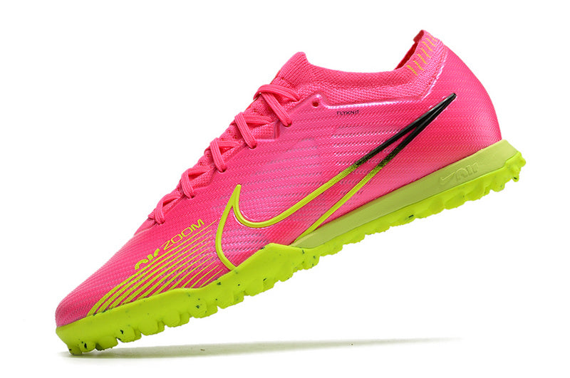 CHUTEIRA NIKE MERCURIAL AIR ZOOM VAPOR 15 ELITE SOCIETY "LUMINOUS" - ROSA E AMARELA