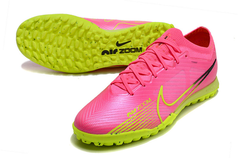 CHUTEIRA NIKE MERCURIAL AIR ZOOM VAPOR 15 ELITE SOCIETY "LUMINOUS" - ROSA E AMARELA