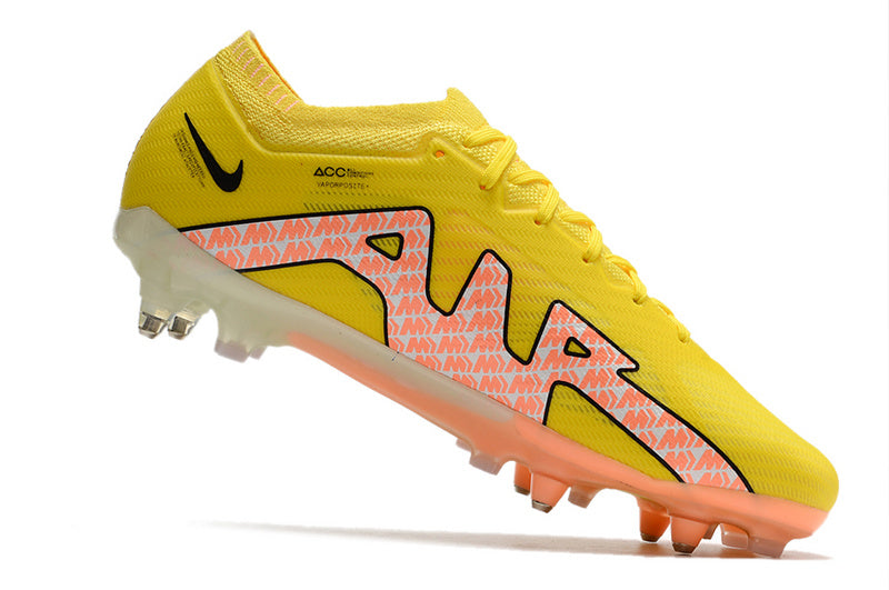 CHUTEIRA NIKE AIR ZOOM MERCURIAL VAPOR 15 ELITE TRAVA MISTA FIXA "LUCENT" AMARELA E LARANJA