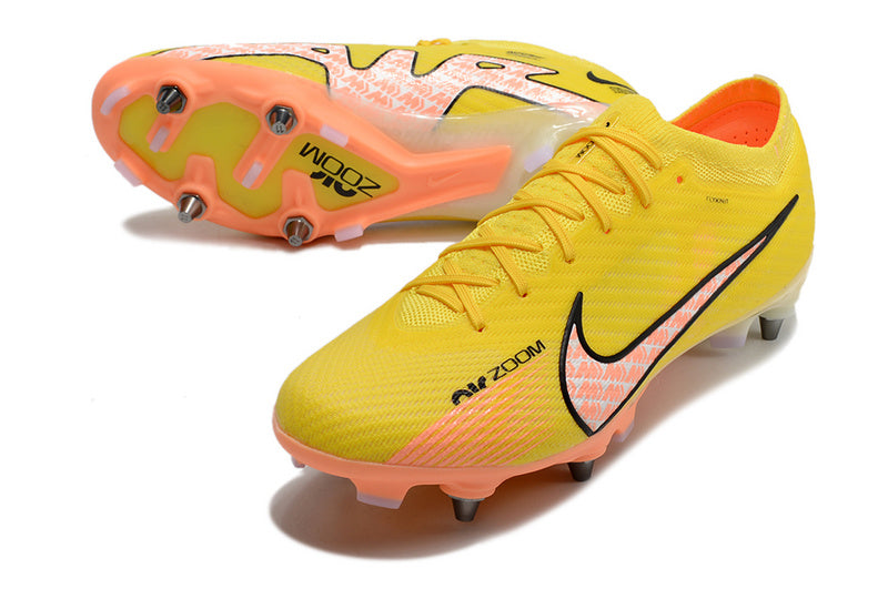 CHUTEIRA NIKE AIR ZOOM MERCURIAL VAPOR 15 ELITE TRAVA MISTA "LUCENT" - AMARELA E LARANJA