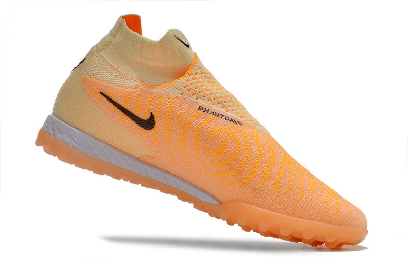 CHUTEIRA NIKE PHANTOM GX DYNAMIC FIT ELITE SOCIETY - LARANJA