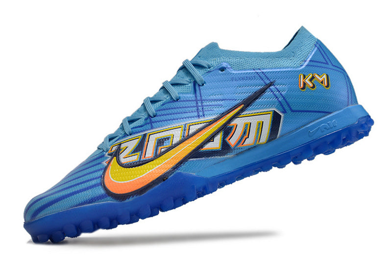 CHUTEIRA NIKE MERCURIAL AIR ZOOM VAPOR 15 ELITE SOCIETY "MBAPPÉ COMIC" - AZUL