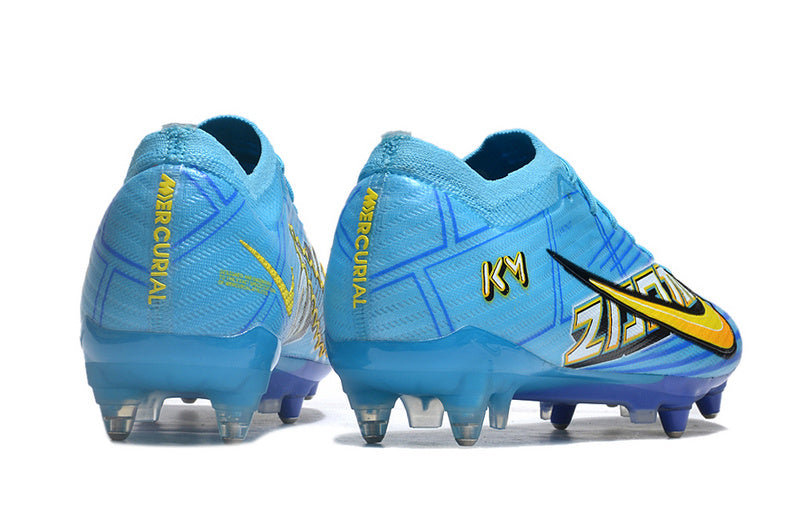 CHUTEIRA NIKE AIR ZOOM MERCURIAL VAPOR 15 ELITE TRAVA MISTA FIXA "MBAPPÉ COMIC" - AZUL E AMARELA
