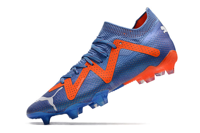 CHUTEIRA PUMA FUTURE ULTIMATE CAMPO "SUPERCHARGE" AZUL E LARANJA