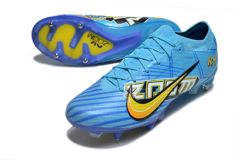 CHUTEIRA NIKE AIR ZOOM MERCURIAL VAPOR 15 ELITE TRAVA MISTA FIXA "MBAPPÉ COMIC" - AZUL E AMARELA