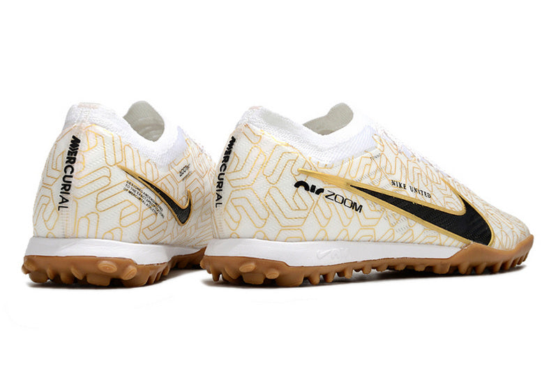 CHUTEIRA NIKE MERCURIAL AIR ZOOM VAPOR 15 ELITE SOCIETY - BRANCA E DOURADA