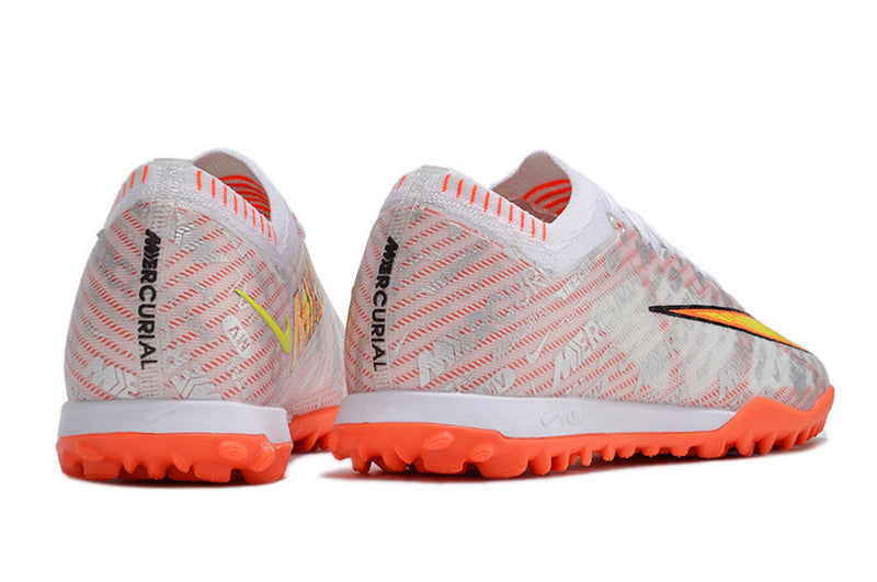 CHUTEIRA NIKE MERCURIAL AIR ZOOM VAPOR 15 ELITE SOCIETY - BRANCA E LARANJA