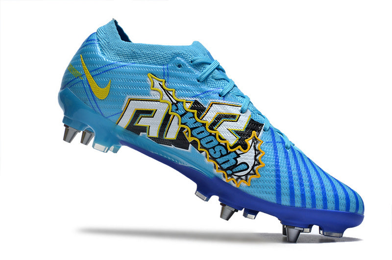 CHUTEIRA NIKE AIR ZOOM MERCURIAL VAPOR 15 ELITE TRAVA MISTA "MBAPPÉ COMIC" - AZUL E AMARELA