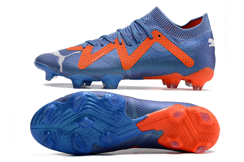 CHUTEIRA PUMA FUTURE ULTIMATE CAMPO "SUPERCHARGE" AZUL E LARANJA