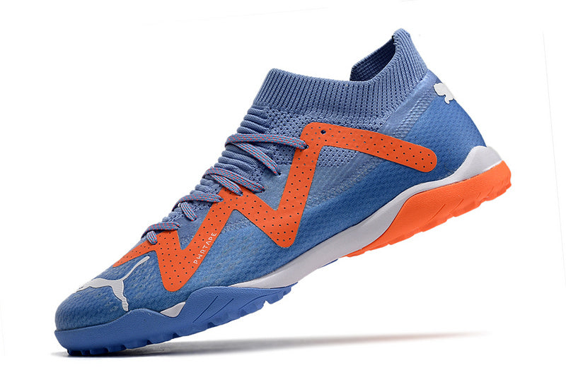 CHUTEIRA PUMA FUTURE ULTIMATE SOCIETY "SUPERCHARGE" - ROXA E LARANJA