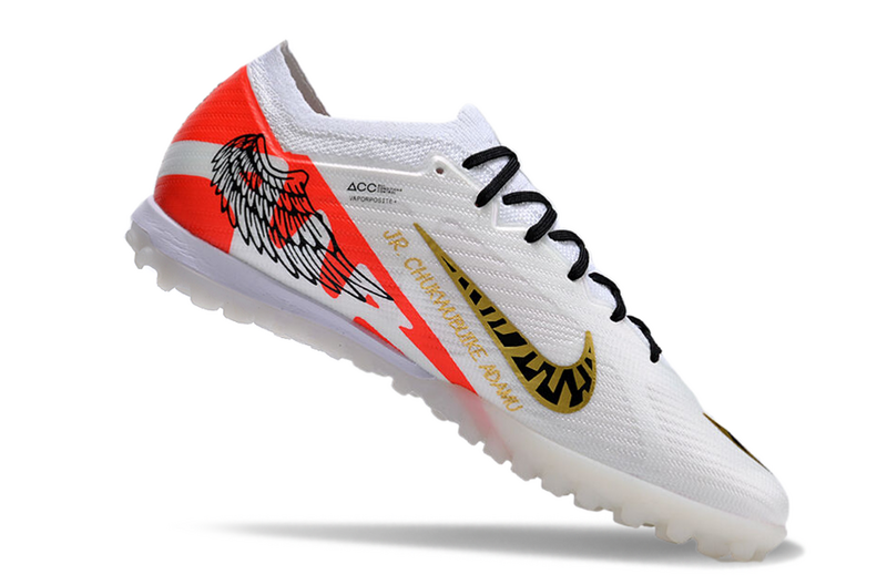 CHUTEIRA NIKE MERCURIAL AIR ZOOM VAPOR 15 ELITE SOCIETY - BRANCA E LARANJA